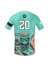 The Teamatical Armed Forces Okinawa Canterbury Men's Maka Reversible Jersey Regular features a teal design with a large number 20 on the back, black armband on the left sleeve, geometric and face graphics, and a white hibiscus flower near the collar.
