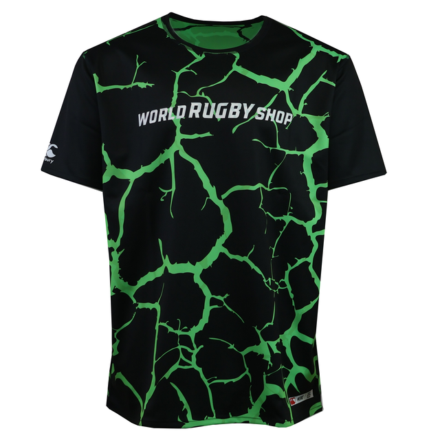 The Teamatical CANTERBURY REVERSIBLE SUBLIMATE SS TRAINING TEE for men features short sleeves, a green cracked sublimated pattern, and "WORLD RUGBY SHOP" printed in white across the chest.