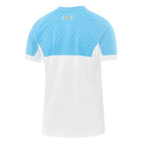 Back view of a white and light blue Aviron Bayonnais 26/27 Stadium Home Jersey by Nike, featuring a pattern on the upper back and a gold emblem below the collar.