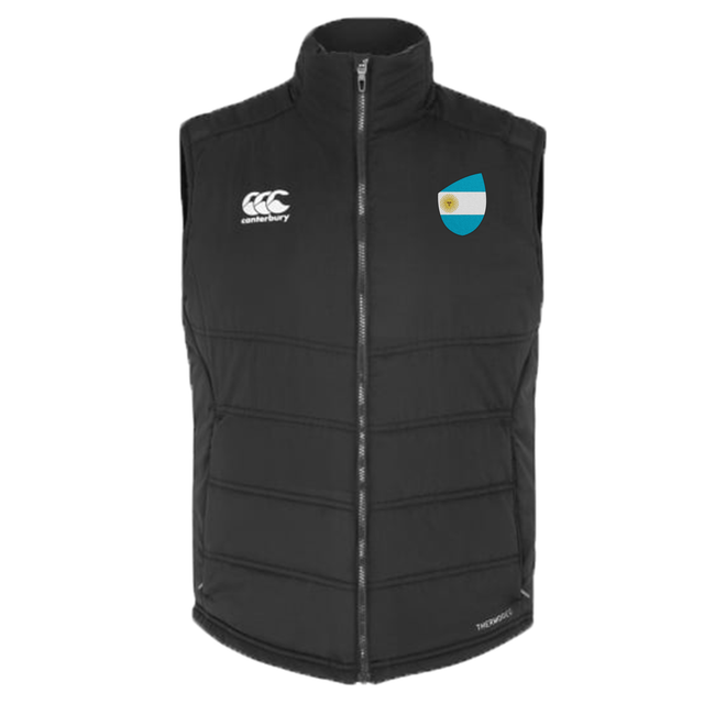 The Argentina Shield Core Gilet by EMB Canterbury is a black puffer vest with the Canterbury logo on the left and a blue and white shield emblem on the right, enhanced with Vaposhield technology for superior water resistance.