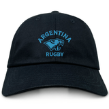 The EMB S&S Activewear Nations of Rugby Argentina Dad Cap is a black cotton twill hat featuring "Argentina Rugby" and a light blue jaguar logo embroidered on the front—ideal for rugby fans.