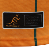 Close-up of a yellow Wallabies "Harlem" Basketball Singlet by Ashtabula, featuring the "Wallabies" logo and an “OFFICIAL LICENSED PRODUCT” black patch next to a green vertical stripe.
