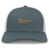 The Arrows Rugby Club Retro Trucker Cap by EMB S&S Activewear features a gray and white design, bold yellow "Arrows Rugby" with three crossed arrows embroidery on the front, and an adjustable snapback closure for a perfect fit.