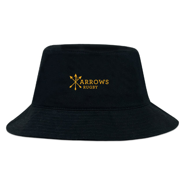 The EMB S&S Activewear Arrows Rugby Club Crusher Bucket Cap is a black cotton twill hat featuring a yellow "Arrows Rugby" logo with crossed arrows, combining classic style and sun protection in a sporty design.