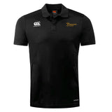 The Arrows Rugby Club Club Dry Polo by EMB Canterbury is a black short-sleeve polo with a collar, featuring white Canterbury and gold Arrows Rugby chest logos. Made with Vapodri Technology for breathability and comfort.