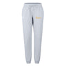 The Arrows Rugby Club Women's Leisure Sweatpant by EMB Canterbury features light gray organic cotton, an elastic waistband, drawstring, and dual side logos—white on the left, yellow on the right—for stylish comfort.