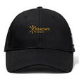 The Arrows Rugby Club Flexfit Drill Cap by EMB Canterbury is a black cap with "Arrows Rugby" and crossed arrows embroidered in yellow on the front, plus the CCC logo on the side.