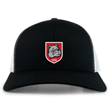 The AG Bulldogs Retro Trucker Cap by EMB S&S Activewear features a black and white design, embroidered bulldog logo with "1920" on a red shield, and an adjustable snapback closure.