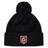 The AG Bulldogs Pom Pom Beanie by EMB Canterbury is a black knit hat with a pom-pom, featuring a red shield logo with a bulldog face and "1920" on the cuff for classic style.