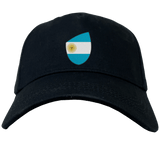 The Argentina Shield Flex Drill Cap by EMB Canterbury features a shield-shaped design with the Argentine flag, ideal for passionate fans.
