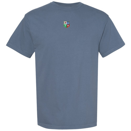 The British & Irish Lions Vintage Comfort Tee by EMB S&S Activewear is a plain blue heavyweight shirt with a small, multicolored four-symbol crest on the chest, inspired by vintage rugby style.