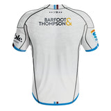 The 2024 Blues Super Rugby Away Jersey by Classic Sportswear showcases a back view with the "Barfoot & Thompson" logo, blue trim, and additional sponsor logos on the sleeves. Crafted with Stay Cool tech fabric for optimal comfort.