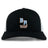 The Ballantyne Ridge Wolves Retro Trucker Cap by EMB S&S Activewear features a black and white design, bold blue and orange "BR Wolves Rugby" embroidery on the front, and a classic snapback closure.