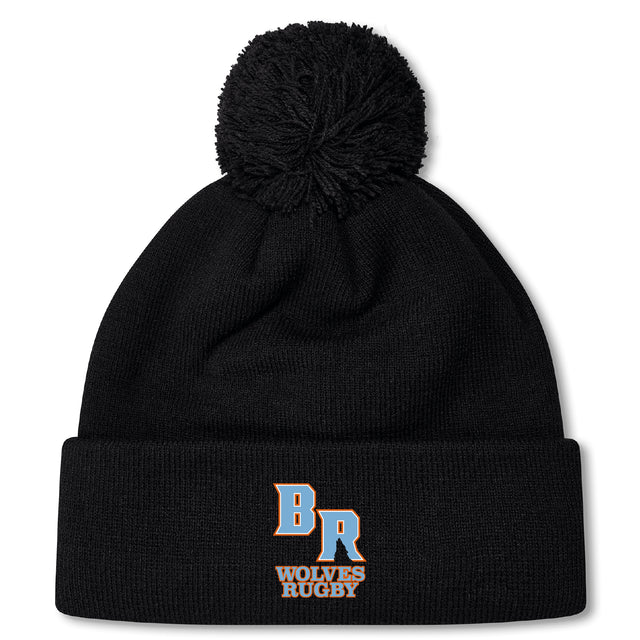The Ballantyne Ridge Wolves Pom Pom Beanie by EMB Canterbury features a black knit design with cozy fleece lining and "BR Wolves Rugby" embroidered in blue and orange on the front cuff.