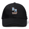 The Ballantyne Ridge Wolves Flexfit Drill Cap by EMB Canterbury is a black cap with a curved brim, featuring an embroidered "BR" and "Wolves Rugby" in orange and white on the front.
