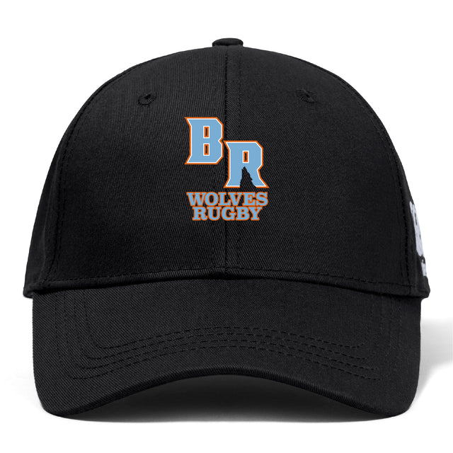The Ballantyne Ridge Wolves Flexfit Drill Cap by EMB Canterbury is a black cap with a curved brim, featuring an embroidered "BR" and "Wolves Rugby" in orange and white on the front.