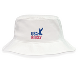Stay stylish with the EMB S&S Activewear USA Rugby Throwback Crusher Bucket Hat, made from cotton twill for comfort and sun protection. Features a blue eagle graphic and bold blue and red "USA RUGBY" text on the front.