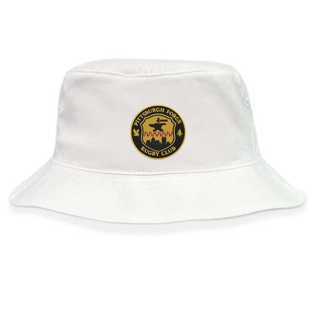 The Pittsburgh Forge Crusher Bucket Cap by EMB S&S Activewear is a white cotton twill hat with a yellow and black circular “Pittsburgh Forge Rugby Club” logo, offering classic style and sun protection.