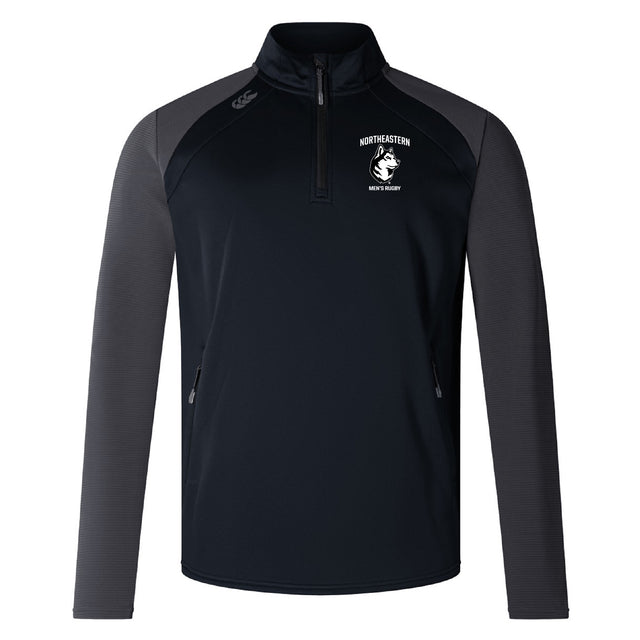 The Northeastern University Men's Rugby Elite First Layer by EMB Canterbury is a black and dark gray quarter-zip top featuring “Northeastern Men’s Rugby” and a wolf logo on the left chest, plus two front zippered pockets. Inspired by Canterbury's Elite design.