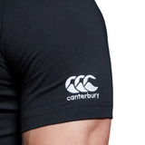 Close-up of a person's upper arm wearing a black WRS Canterbury North Carolina CCC Flag Club T-shirt, featuring the iconic Canterbury logo and brand name in white on the sleeve.