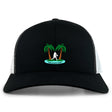 The Twin Island Rugby Retro Trucker Cap by EMB S&S Activewear features black and white panels, embroidered palm trees, a rugby player silhouette, “Twin Island Rugby” text, and an adjustable snapback closure.