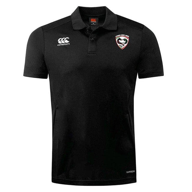 The Loudoun Club Dry Polo by EMB Canterbury is a black short-sleeved shirt with a classic collar, showcasing a tiger head logo on the chest and the Canterbury logo on the opposite side. Designed with Vapodri Technology, it ensures enhanced breathability for comfort all day long.