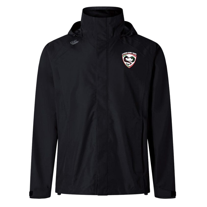 Introducing the Loudoun Elite Storm Jacket by EMB Canterbury, a black hooded jacket designed with outdoor specialist fabrics. It features a logo incorporating a shield and stylized face on the left chest. Perfect for adventures, its Vaposhield performance guarantees you stay dry and comfortable.