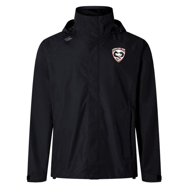 Introducing the Loudoun Elite Storm Jacket by EMB Canterbury, a black hooded jacket designed with outdoor specialist fabrics. It features a logo incorporating a shield and stylized face on the left chest. Perfect for adventures, its Vaposhield performance guarantees you stay dry and comfortable.