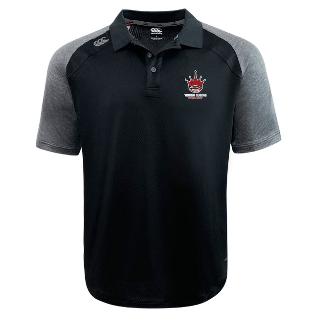 The Chattanooga Queens Rugby Elite Polo by EMB Canterbury is a black and gray short-sleeve polo crafted from lightweight Vapodri fabric, featuring a collar, buttons, and an embroidered "Hoops Dream" logo with red basketball and crown on the chest.