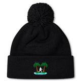 Stay warm in the Twin Island Rugby Pom Pom Beanie by EMB Canterbury. This black knit, fleece-lined beanie features a pom-pom, embroidered rugby player between two palm trees, and "TWIN ISLAND RUGBY" text.