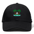 The Twin Island Rugby Flexfit Drill Cap by EMB Canterbury features a black curved brim, embroidered two palm trees, rugby player silhouette, and "Twin Island Rugby" text on the front for comfort and style.