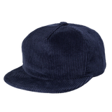 The Weld Corduroy Field Trip Hat in navy blue features a flat brim and is shown at a slight angle against a plain background.