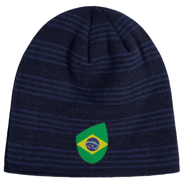 A navy blue beanie with dark stripes, featuring a patch showcasing a stylized Brazil Shield design by EMB Canterbury.