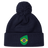 The EMB Canterbury Brazil Shield Pom Pom Beanie in navy blue features a colorful green and yellow patch with a map design, topped with a playful pom pom.