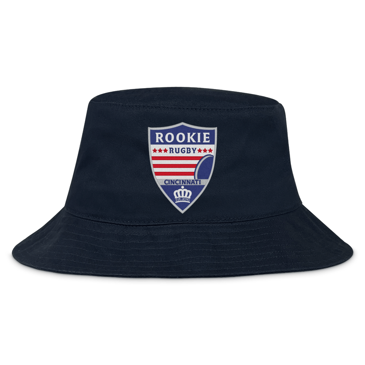 The Cincinnati Rookie Rugby Crusher Bucket Cap by EMB S&S Activewear features durable cotton twill in navy blue and a shield-shaped red, white, and blue "Rookie Rugby Cincinnati" logo on the front for classic style and sun protection.