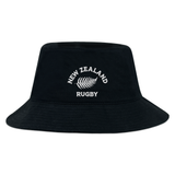 The EMB S&S Activewear Nations of Rugby New Zealand Rugby Crusher Bucket Hat features “NEW ZEALAND RUGBY” and a silver fern logo embroidered in white—a must-have accessory for any rugby supporter.