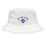 The EMB S&S Activewear Ireland Rugby 1875 Crusher Bucket Hat features white cotton twill, "Ireland Rugby" and "EST. 1875" in blue above a blue shield with three shamrocks. Ideal for any Ireland supporter!.