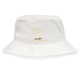 The Cal Maritime Rugby Crusher Bucket Cap by EMB S&S Activewear is a white cotton twill hat with an embroidered sailboat, gold and black text, and the years 1921 and 1938 on the front for stylish sun protection.