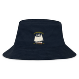 The Cal Maritime Rugby Crusher Bucket Cap by EMB S&S Activewear is a navy blue cotton twill hat with an embroidered white sailing ship and yellow "Cal Maritime R.I.P.C. 1927 S/V Tanker 1994" text, offering comfortable sun protection.