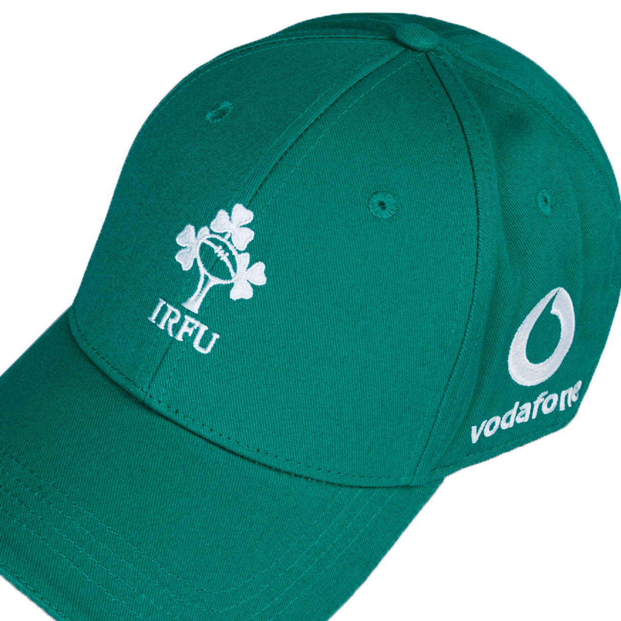 The Ireland 24 Drill Cap by Canterbury is a green cotton cap with a high-definition "IRFU" and shamrock logo embroidered on the front, and a white "Vodafone" logo on the side.