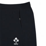 Close-up of the Canterbury Women’s Ireland 26 6″ Woven Gym Short in black, featuring a zippered pocket and the IRFU shamrock logo, inspired by classic Ireland Rugby shorts.