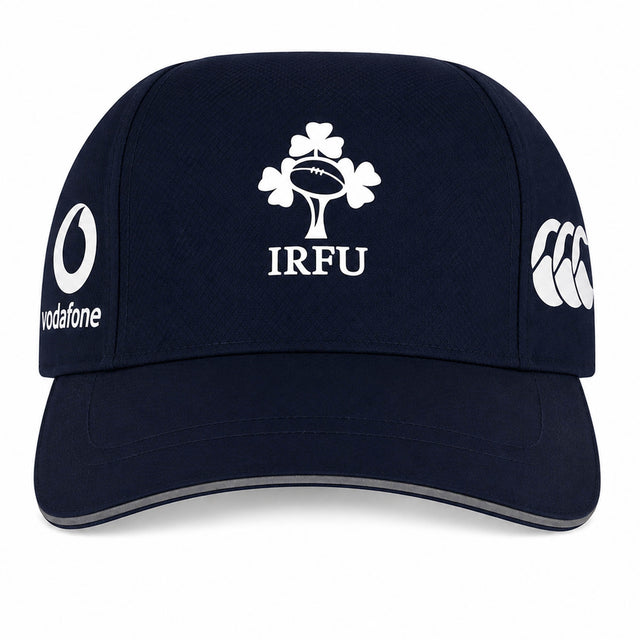 Show off your Ireland pride with the Ireland 26 Tempo+ Mesh Cap by Canterbury—a stylish navy blue cap showcasing the iconic IRFU logo on the front, the Vodafone logo on the left side, and Canterbury branding on the right—making it an essential accessory for any devoted Ireland Rugby fan.