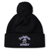 A black knit Ardrey Kell Rugby Pom Pom Beanie by Canterbury with a pom-pom on top. "Knights Rugby" and a knight's helmet are embroidered in white and purple on the folded cuff, making it perfect for Canterbury Rugby fans.