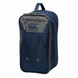 The Canterbury Classic Bootbag is a navy blue and gray zippered rugby boot bag with a top handle and the Canterbury logo on the front, featuring Vaposhield technology for enhanced water resistance.