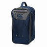 The Canterbury Classic Bootbag is a navy blue and gray zippered rugby boot bag with a top handle and the Canterbury logo on the front, featuring Vaposhield technology for enhanced water resistance.