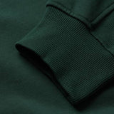 Close-up of a dark green sweatshirt sleeve and cuff featuring ribbed knit texture and stitching details, highlighting the craftsmanship of the Canterbury Ireland 26 Leisure Hoodie.