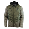 The Canterbury Ireland 25/26 Hybrid Padded Jacket features a quilted olive green front, grey sleeves and hood, IRFU and Canterbury chest logos, and ThermoReg technology for extra warmth in a stylish two-tone zip-up design.