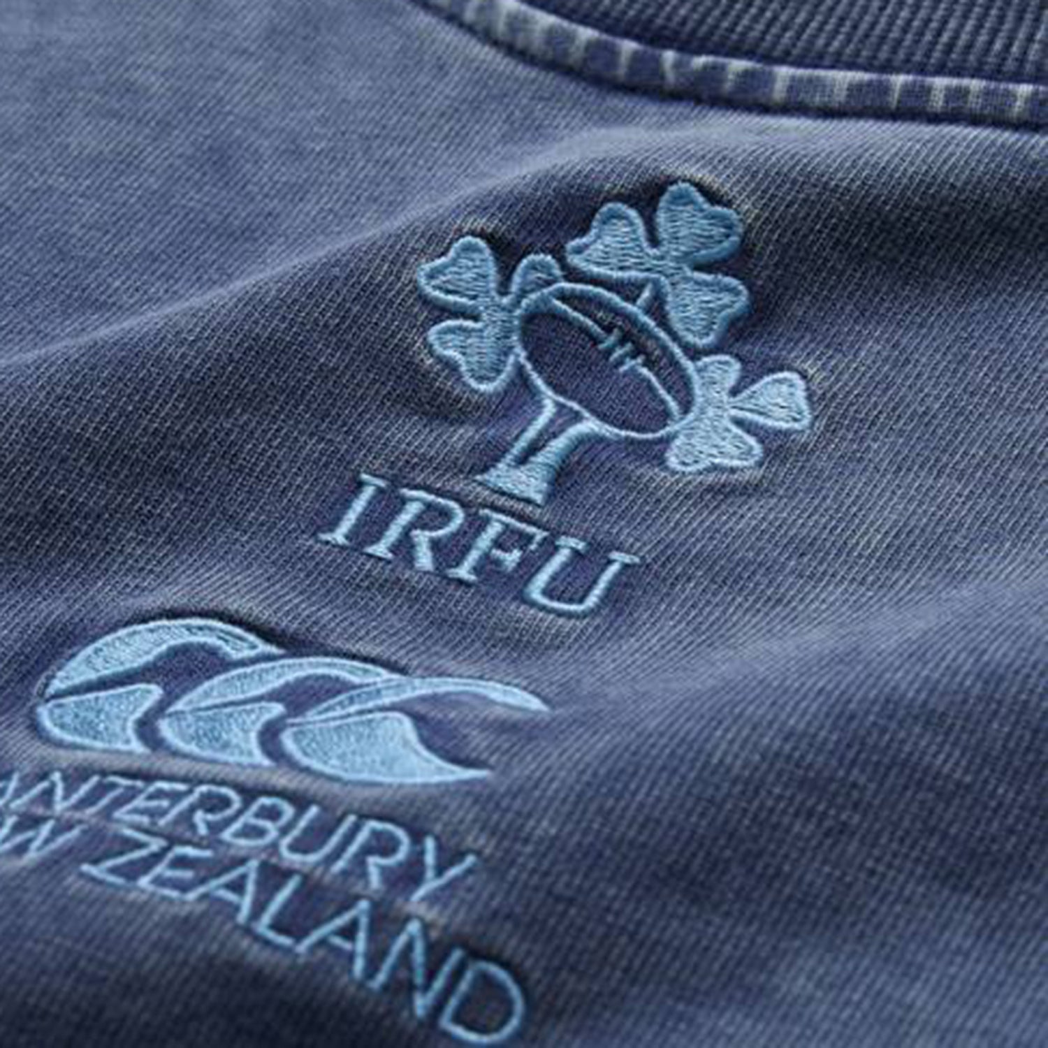 Showcasing the Ireland 26 Premium OS Washed T-shirt by Canterbury, this blue tee highlights the embroidered IRFU shamrock and rugby ball logo situated above the signature Canterbury logo. Crafted for an oversized fit, it offers enhanced comfort and modern style.