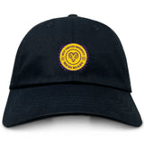 The EMB S&S Activewear West Chester University Adult Low-Profile Cotton Twill Dad Cap has a black design with a circular yellow and purple "West Chester University Men's Rugby" embroidered logo featuring a ram head.