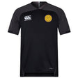 The EMB Canterbury West Chester University Vapodri Evader Jersey is a short-sleeved black rugby top with moisture-wicking tech, Canterbury logo on the right chest, and a yellow circular badge on the left, shown on a white background.